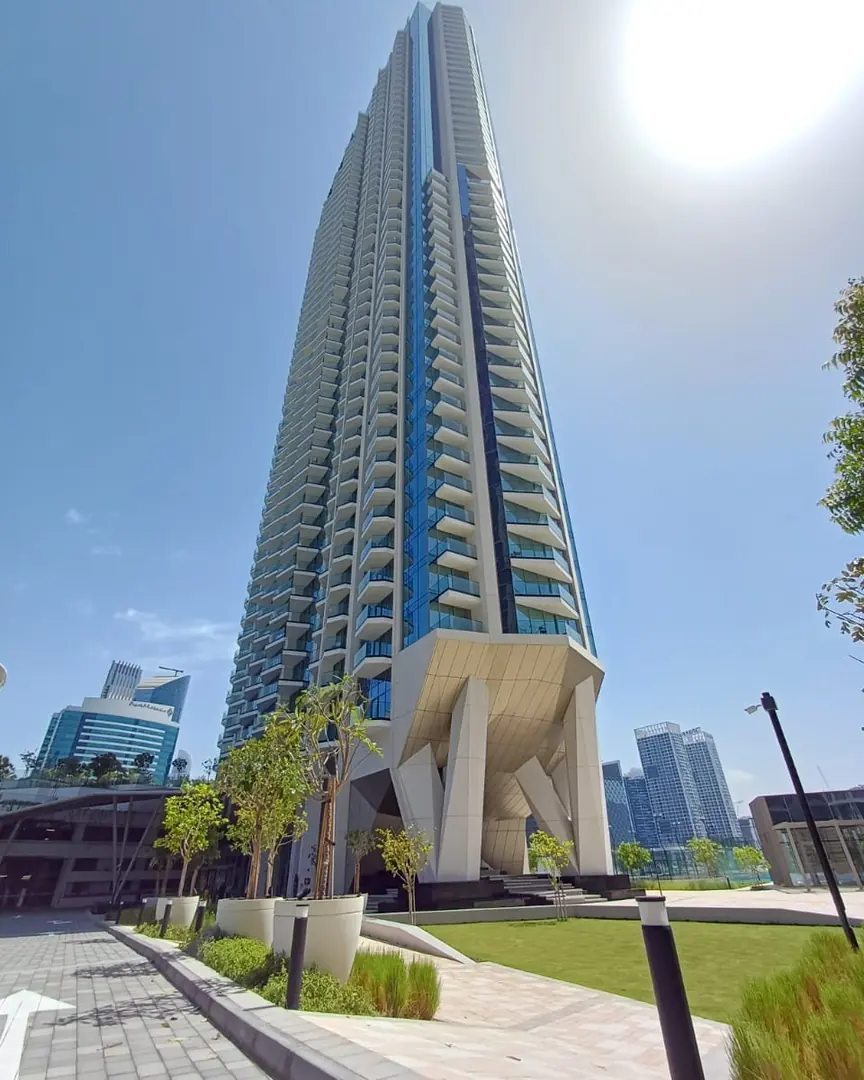 Peninsula Three tower and its landscaped entrance in Business Bay